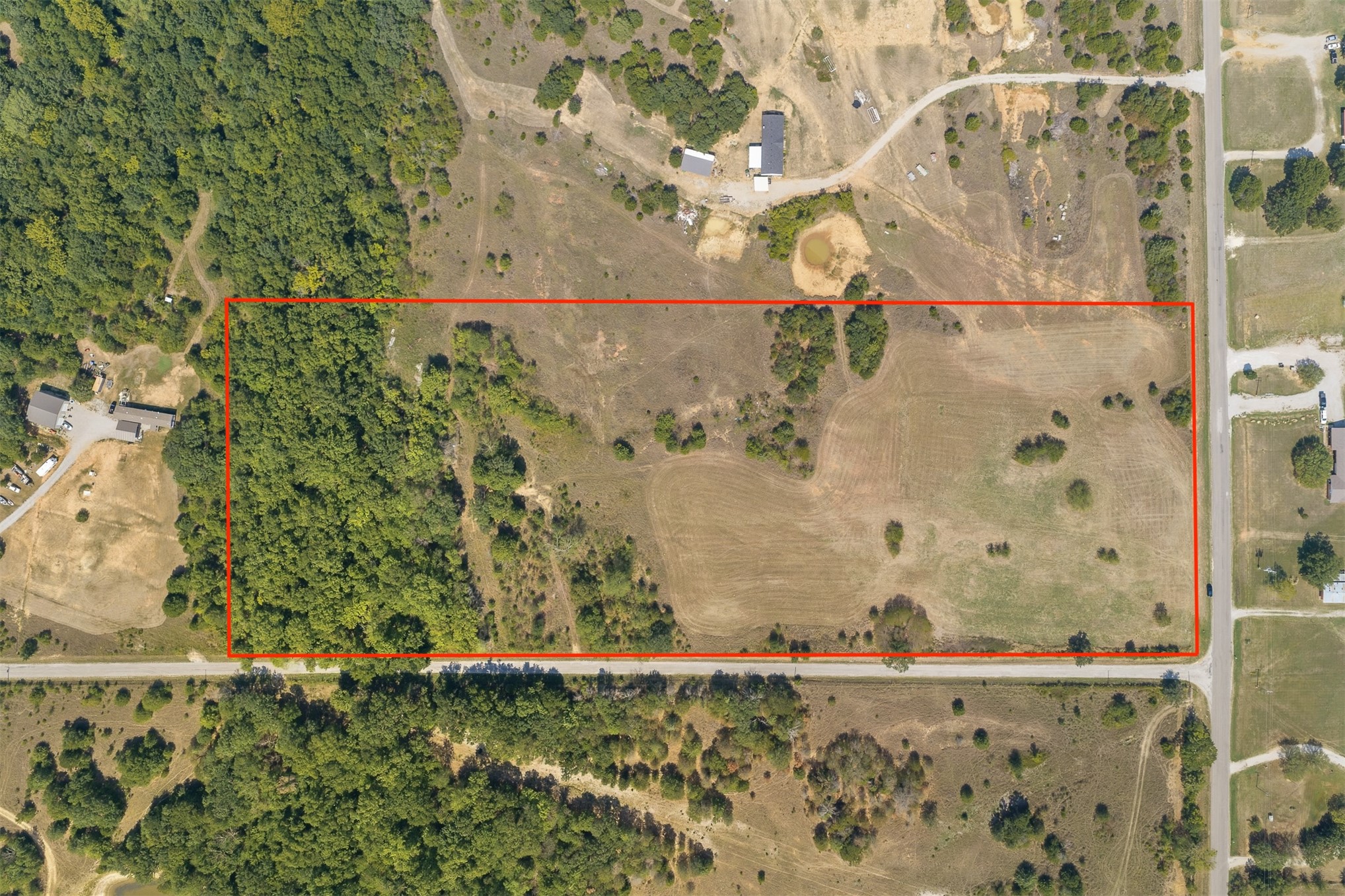 162 Big Bear Road Lone Grove, OK 73443 - Photo 1 of 12 Expansive land parcel with substantial tree coverage and cleared areas