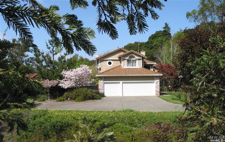 10 Point Gallinas Road San Rafael, CA 94903 - Photo 1 of 1 a front view of a house with a yard and garage