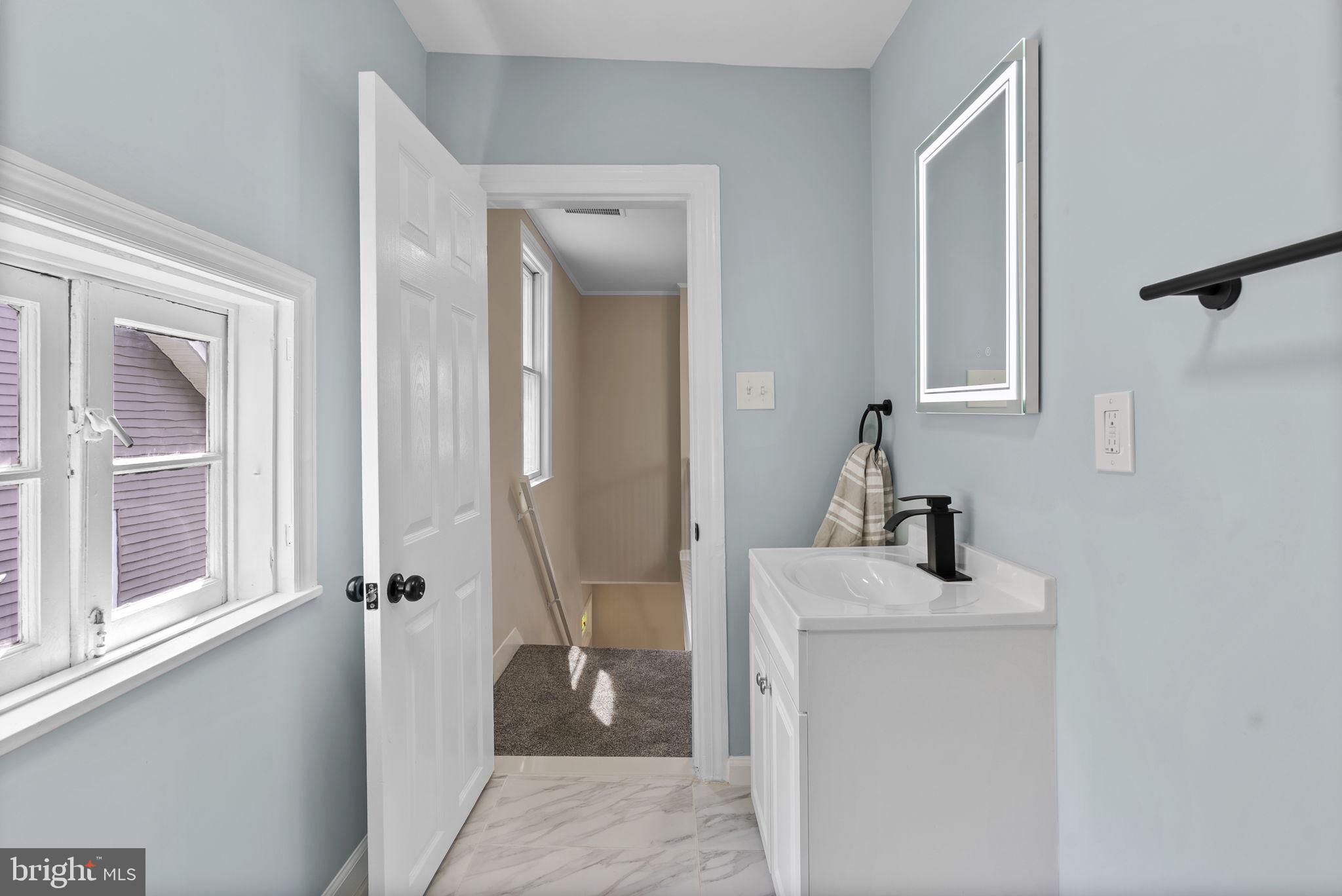 8020 Old Philadelphia Road Baltimore, MD 21237 - Photo 19 of 37 a bathroom with a sink toilet and shower