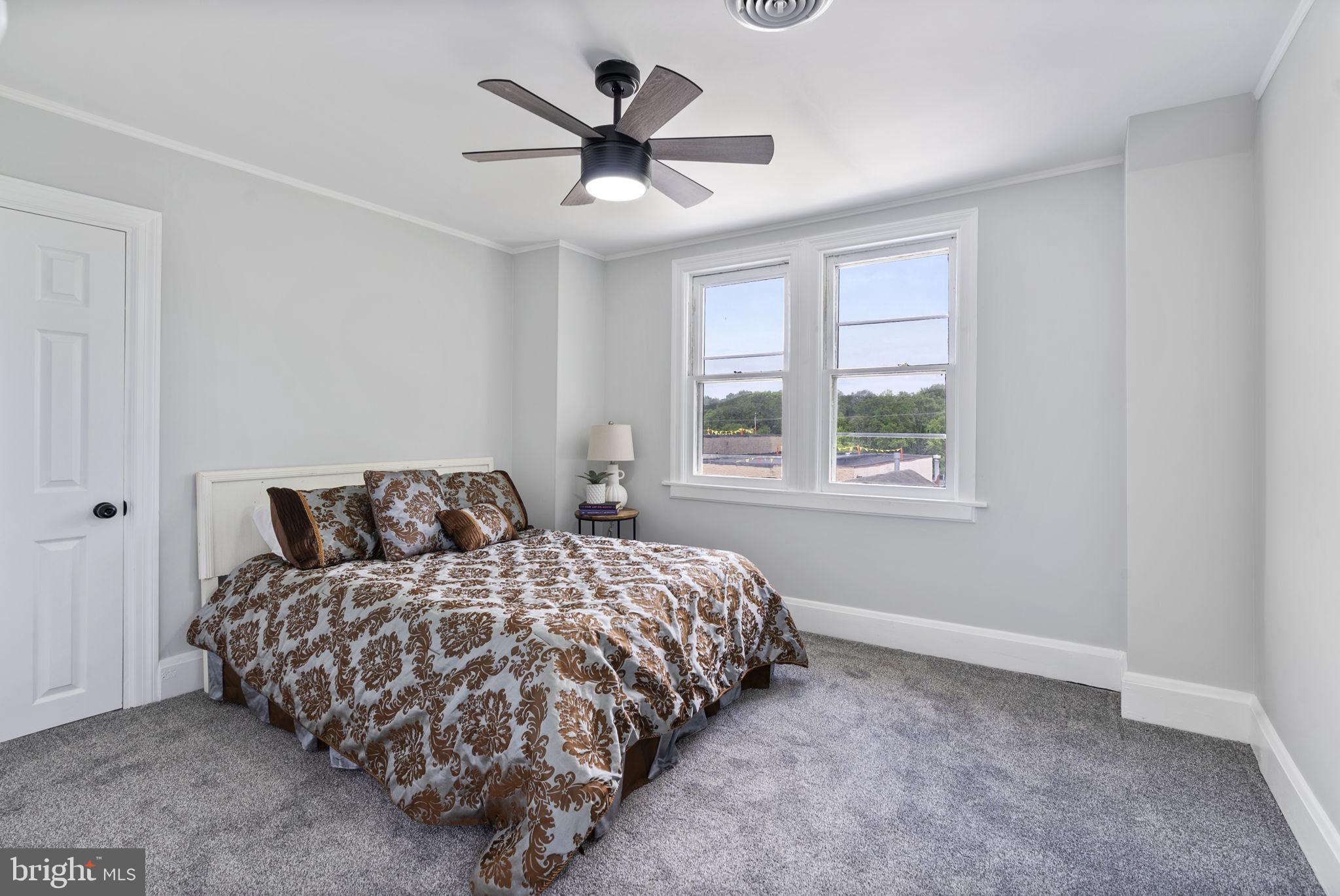 8020 Old Philadelphia Road Baltimore, MD 21237 - Photo 20 of 37 a bedroom with a large bed and a window