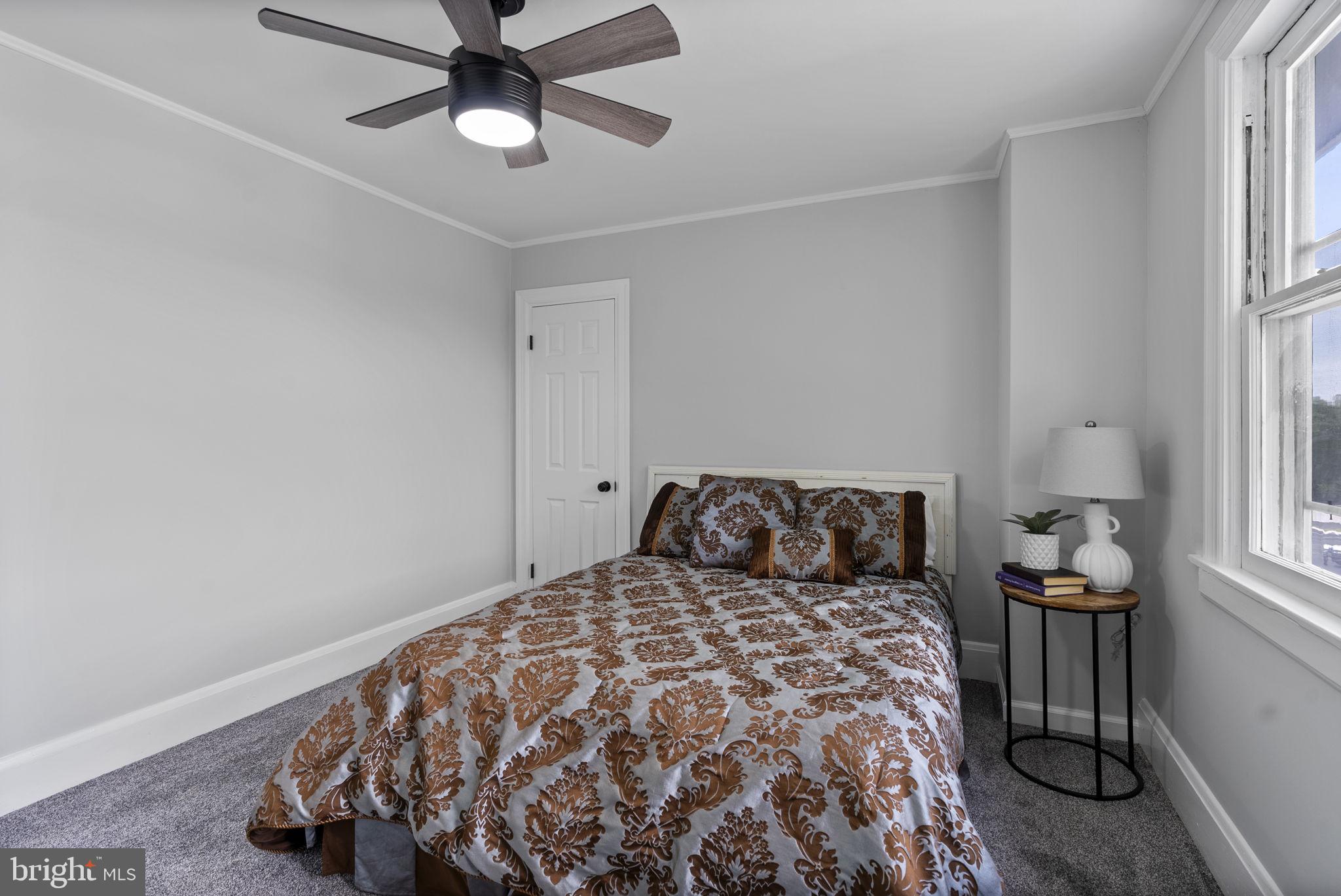 8020 Old Philadelphia Road Baltimore, MD 21237 - Photo 21 of 37 a bedroom with a bed and a window