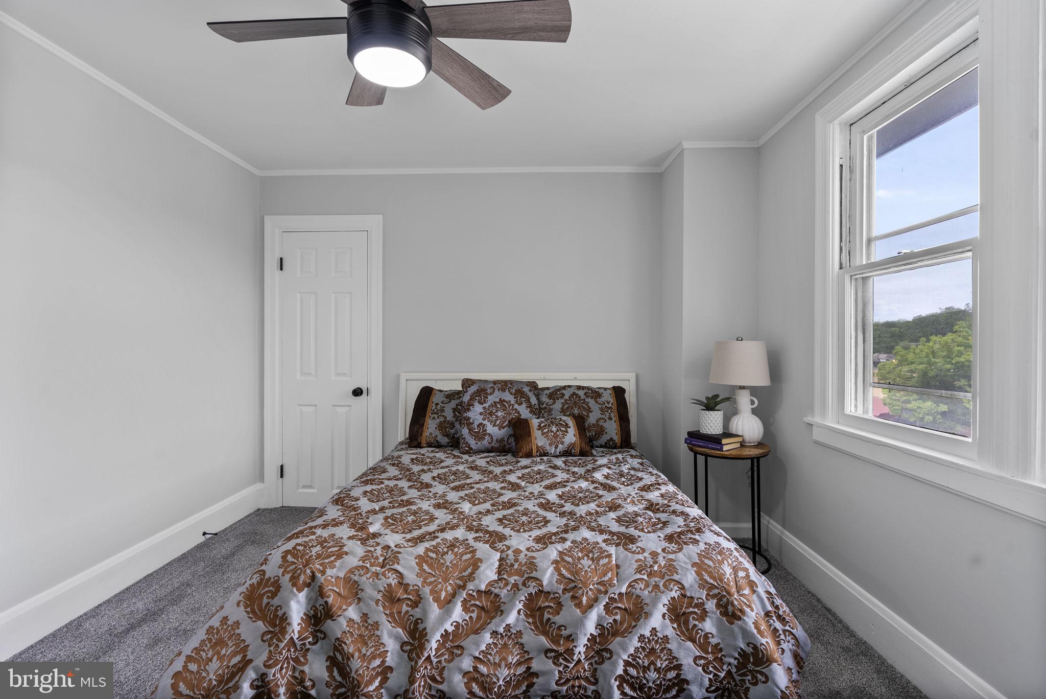 8020 Old Philadelphia Road Baltimore, MD 21237 - Photo 22 of 37 a bedroom with a bed and window