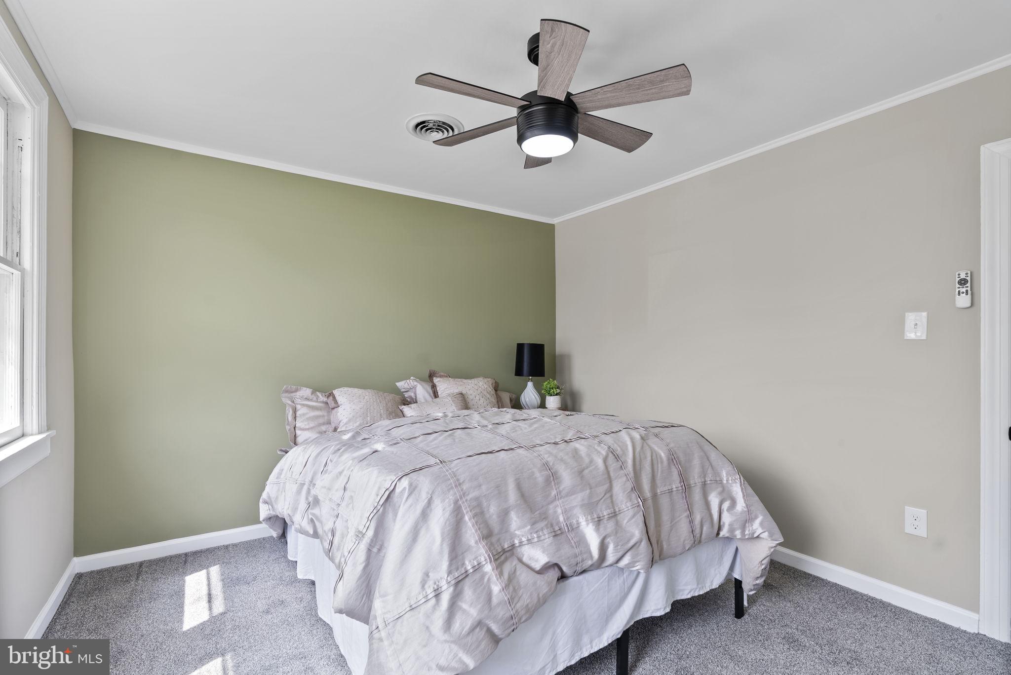 8020 Old Philadelphia Road Baltimore, MD 21237 - Photo 26 of 37 a bedroom with a bed and a ceiling fan