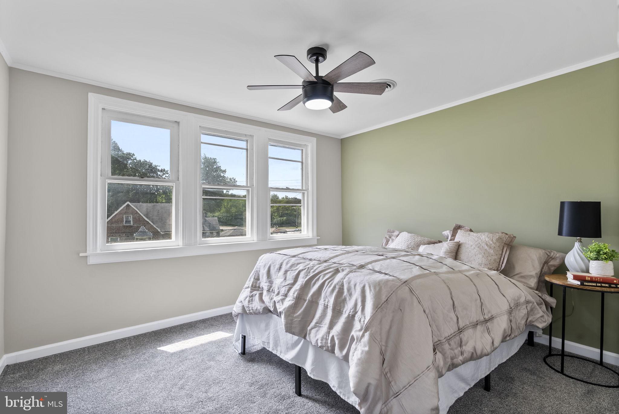 8020 Old Philadelphia Road Baltimore, MD 21237 - Photo 27 of 37 a bed sitting in a bedroom next to a window