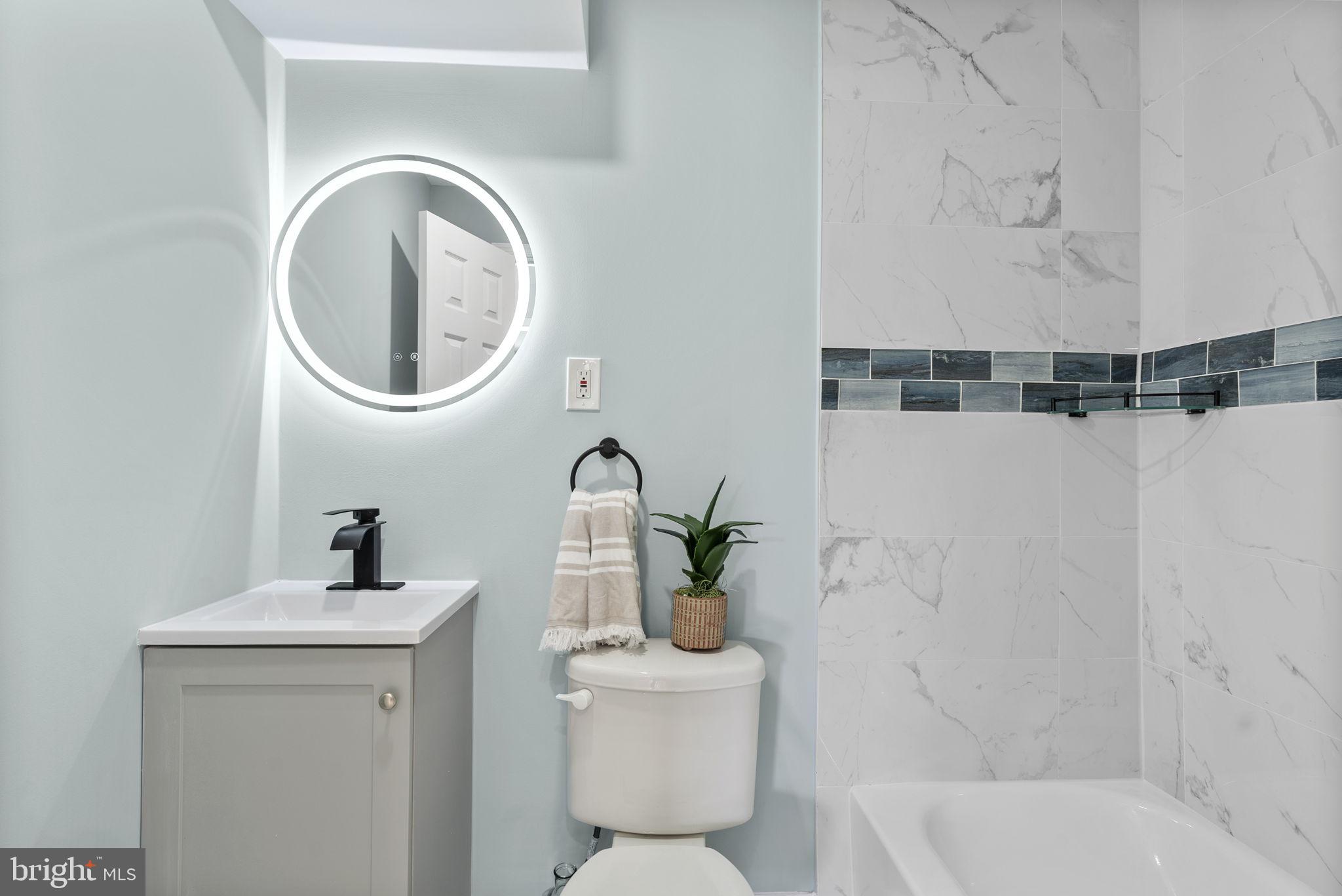 8020 Old Philadelphia Road Baltimore, MD 21237 - Photo 28 of 37 a bathroom with a sink a mirror and toilet