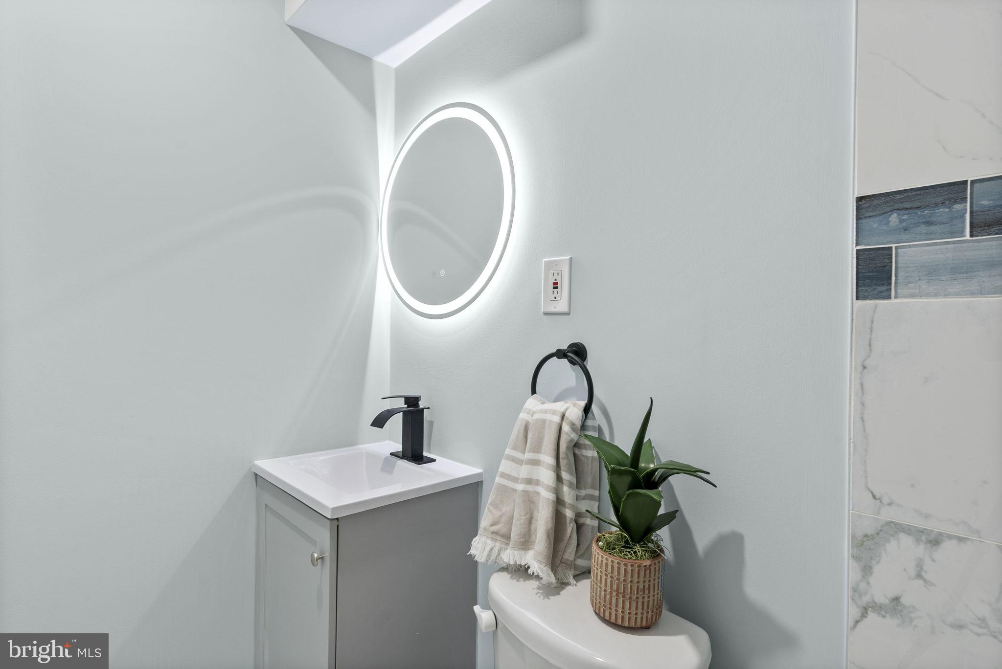 8020 Old Philadelphia Road Baltimore, MD 21237 - Photo 29 of 37 a bathroom with a sink and a mirror