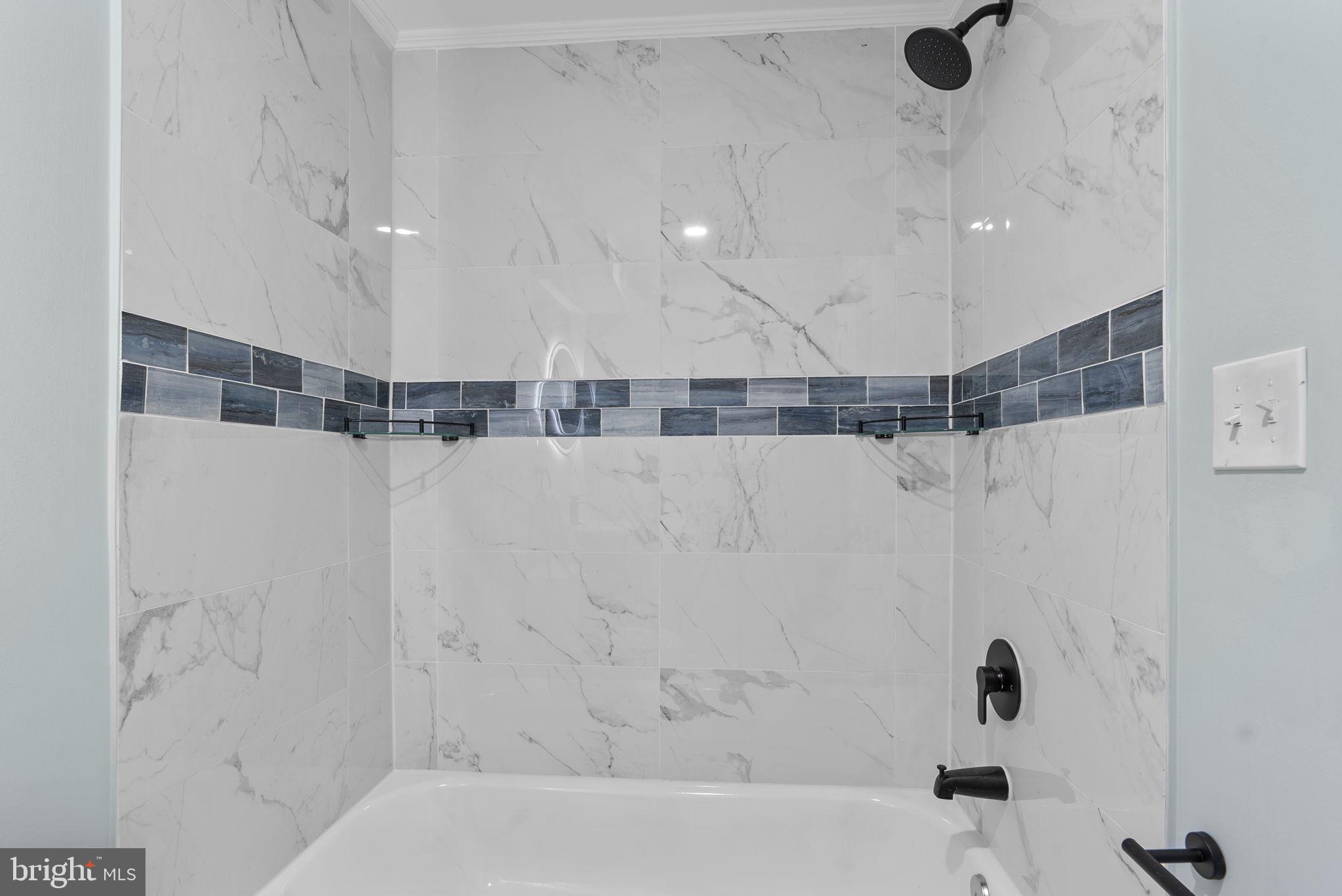 8020 Old Philadelphia Road Baltimore, MD 21237 - Photo 30 of 37 a bathroom with a bathtub and shower