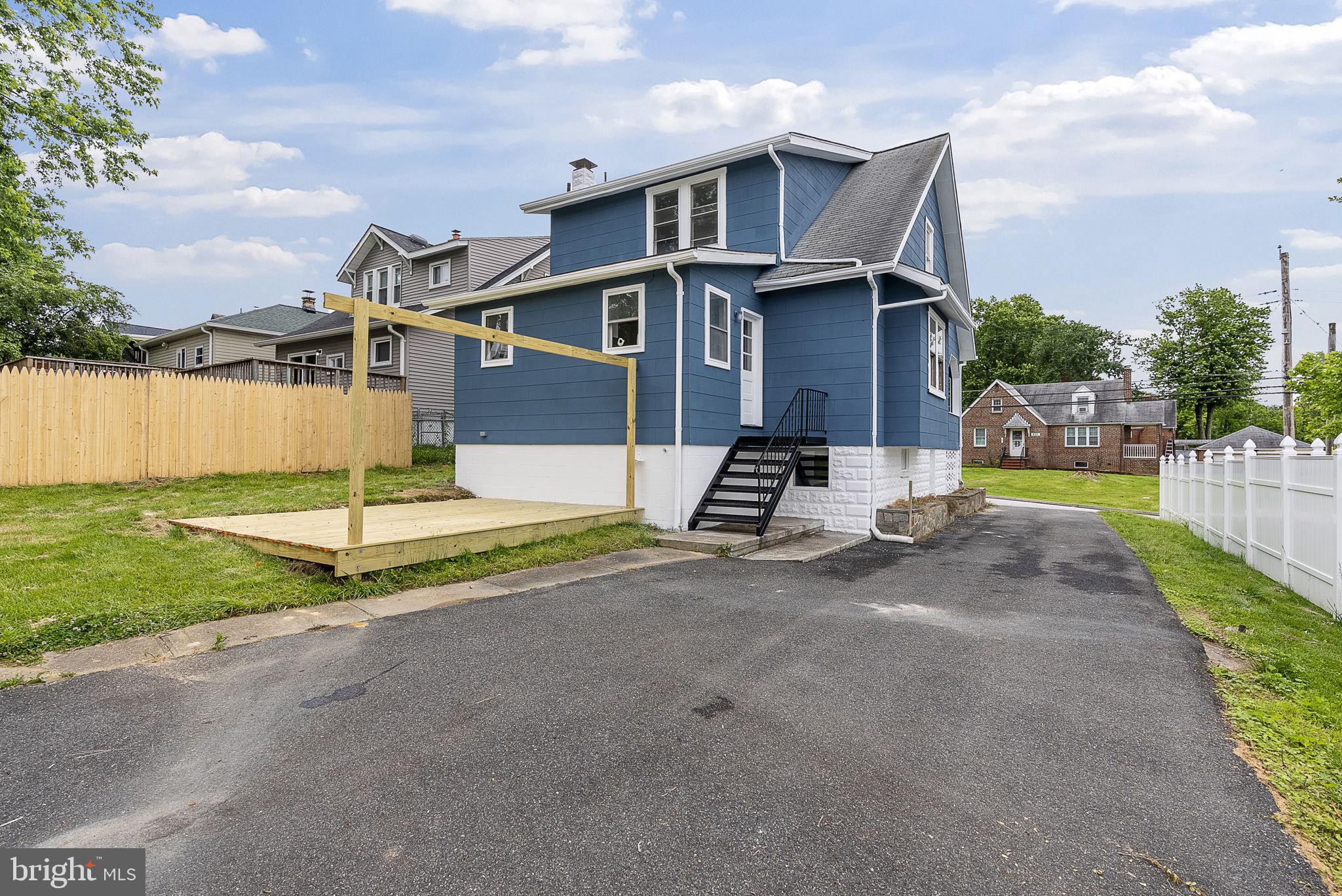 8020 Old Philadelphia Road Baltimore, MD 21237 - Photo 33 of 37 a front view of a house with a yard