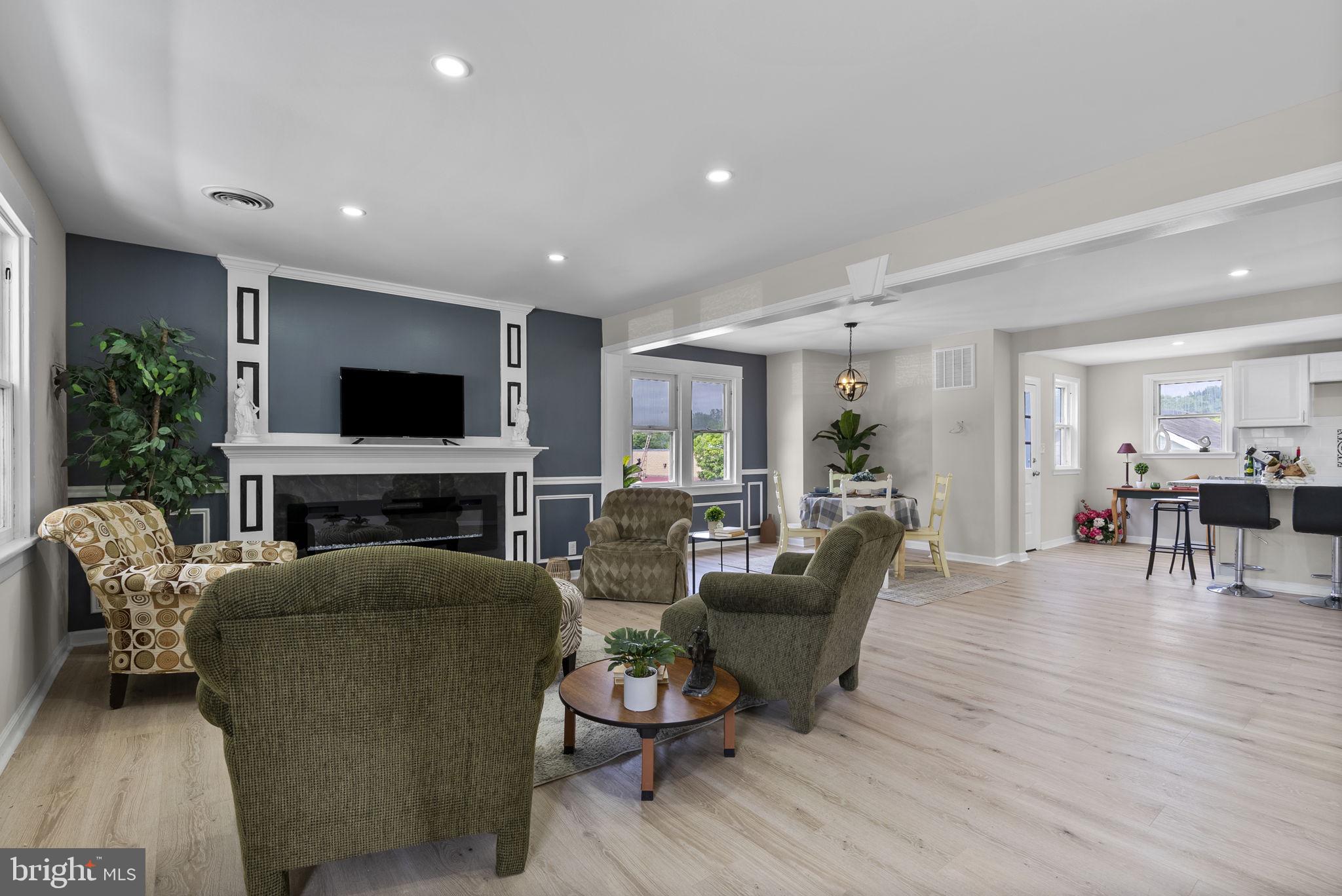 8020 Old Philadelphia Road Baltimore, MD 21237 - Photo 5 of 37 a living room with furniture and a flat screen tv