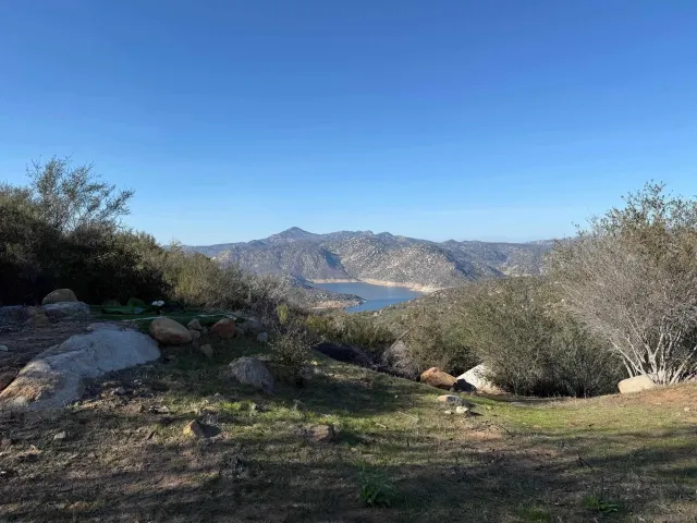 a view of a lake with mountains in the background
