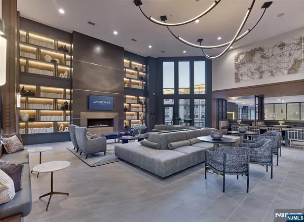 a living room with fireplace furniture and a flat screen tv