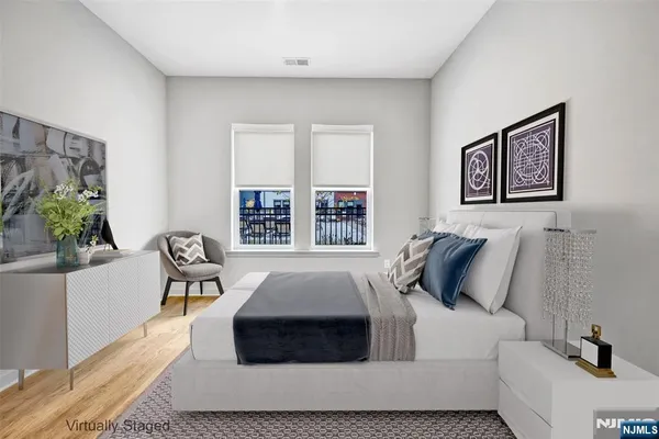 a bedroom with a bed and a couch
