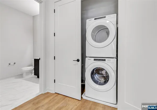 a utility room with sink dryer and washer