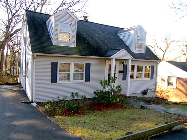 64 Bertwell Road Lexington, MA 02420 - Photo 1 of 18 front view of a house with a yard