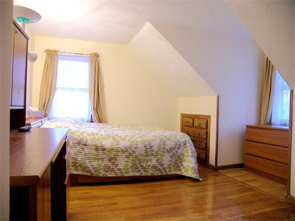 64 Bertwell Road Lexington, MA 02420 - Photo 12 of 18 a bedroom with a bed and a flat screen tv