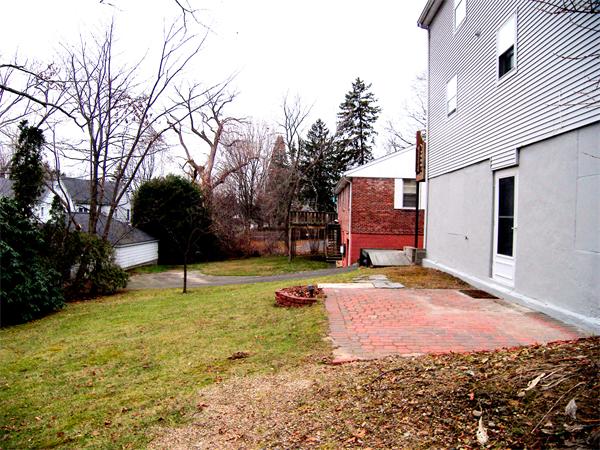 64 Bertwell Road Lexington, MA 02420 - Photo 17 of 18 a backyard of a house with lots of green space