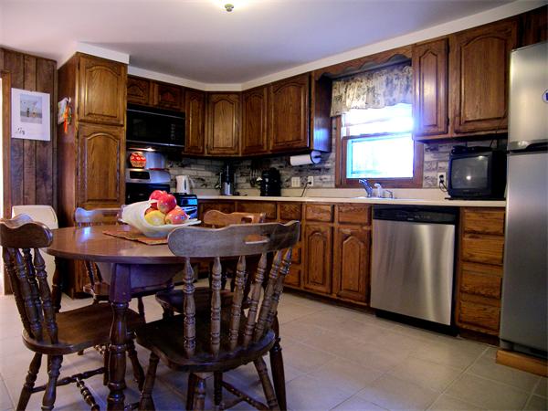 64 Bertwell Road Lexington, MA 02420 - Photo 4 of 18 a kitchen with stainless steel appliances a sink a stove a table and chairs