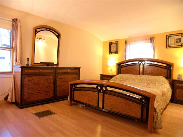 64 Bertwell Road Lexington, MA 02420 - Photo 8 of 18 a bedroom with a bed and a dresser