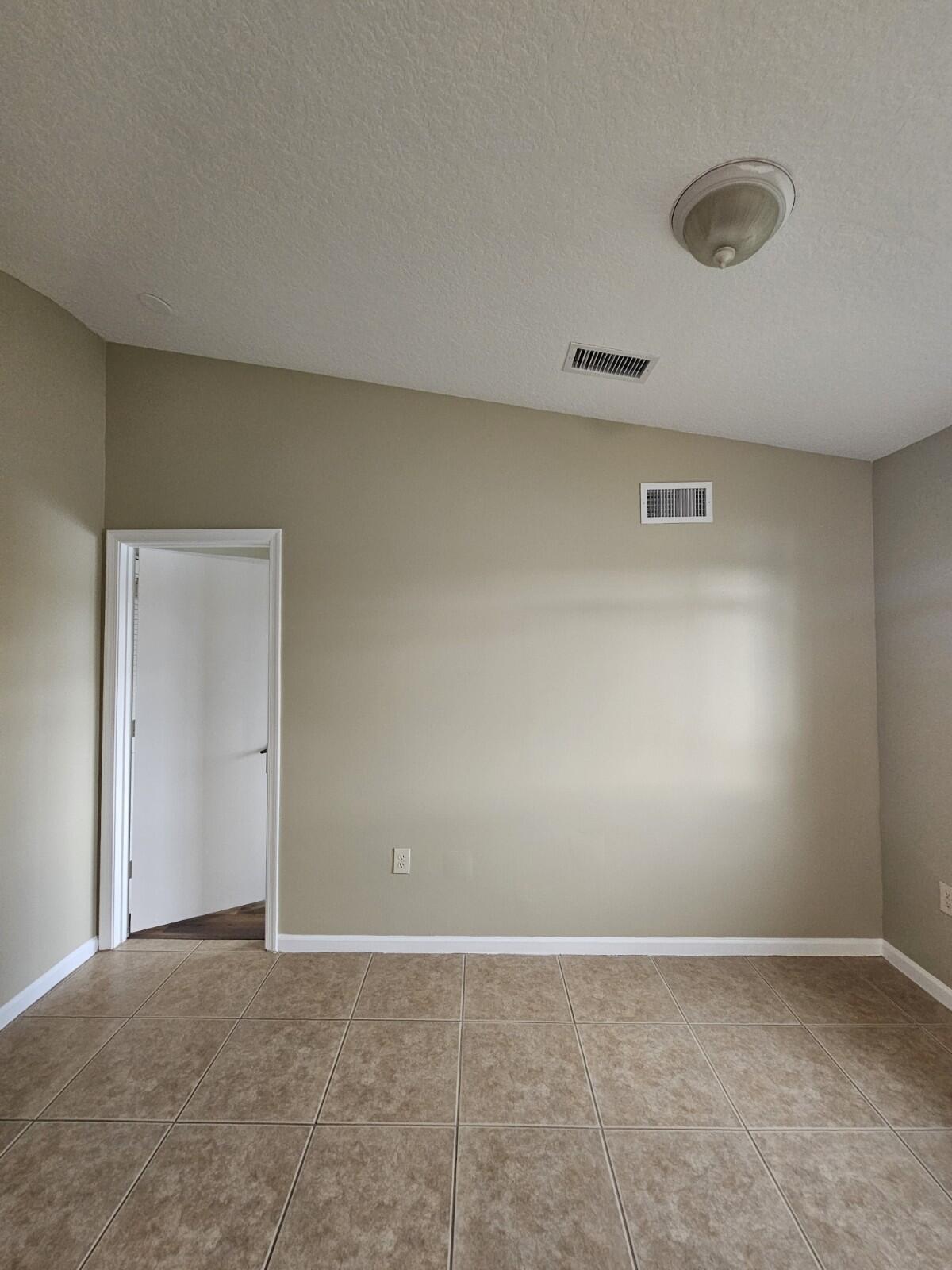3490 Briar Bay Boulevard, Unit 206 West Palm Beach, FL 33411 - Photo 14 of 25 a view of an empty room