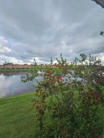 a view of an empty room and wooden floor