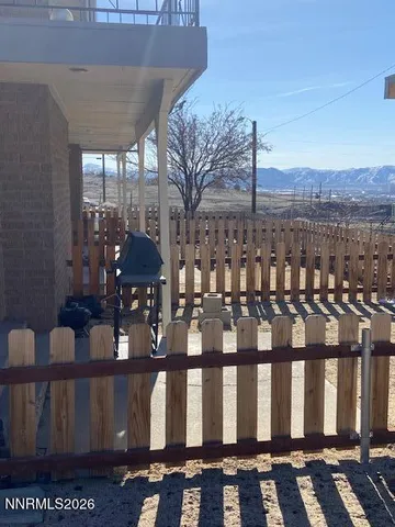 a view of a chairs and table in the balcony