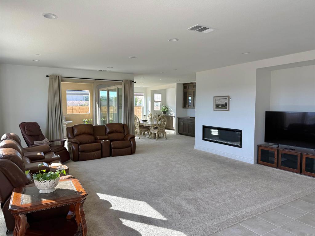 39529 Dayspring Way Temecula, CA 92591 - Photo 11 of 49 a living room with furniture and a flat screen tv