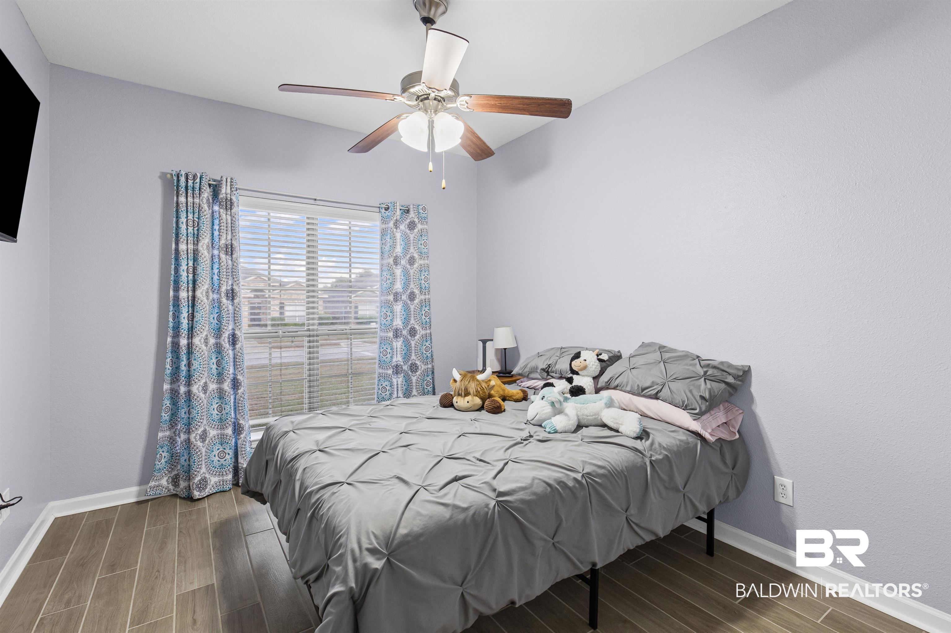 4107 Nottingham Drive Semmes, AL 36575 - Photo 13 of 23 Bedroom featuring wood tiled floors and a ceiling fan