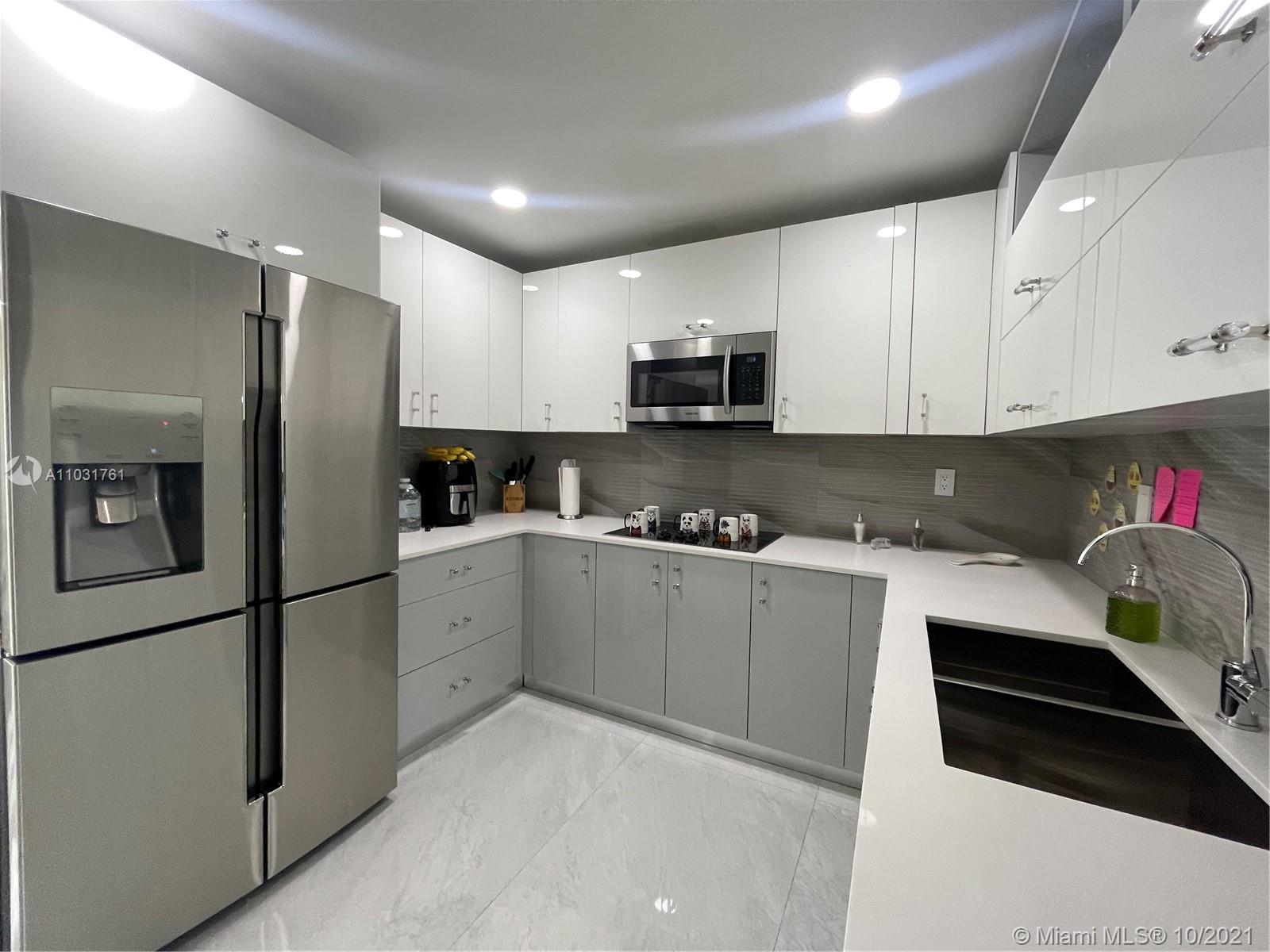 3541 Southwest 105th Court Miami, FL 33165 - Photo 13 of 45 a kitchen with stainless steel appliances granite countertop a refrigerator sink and microwave