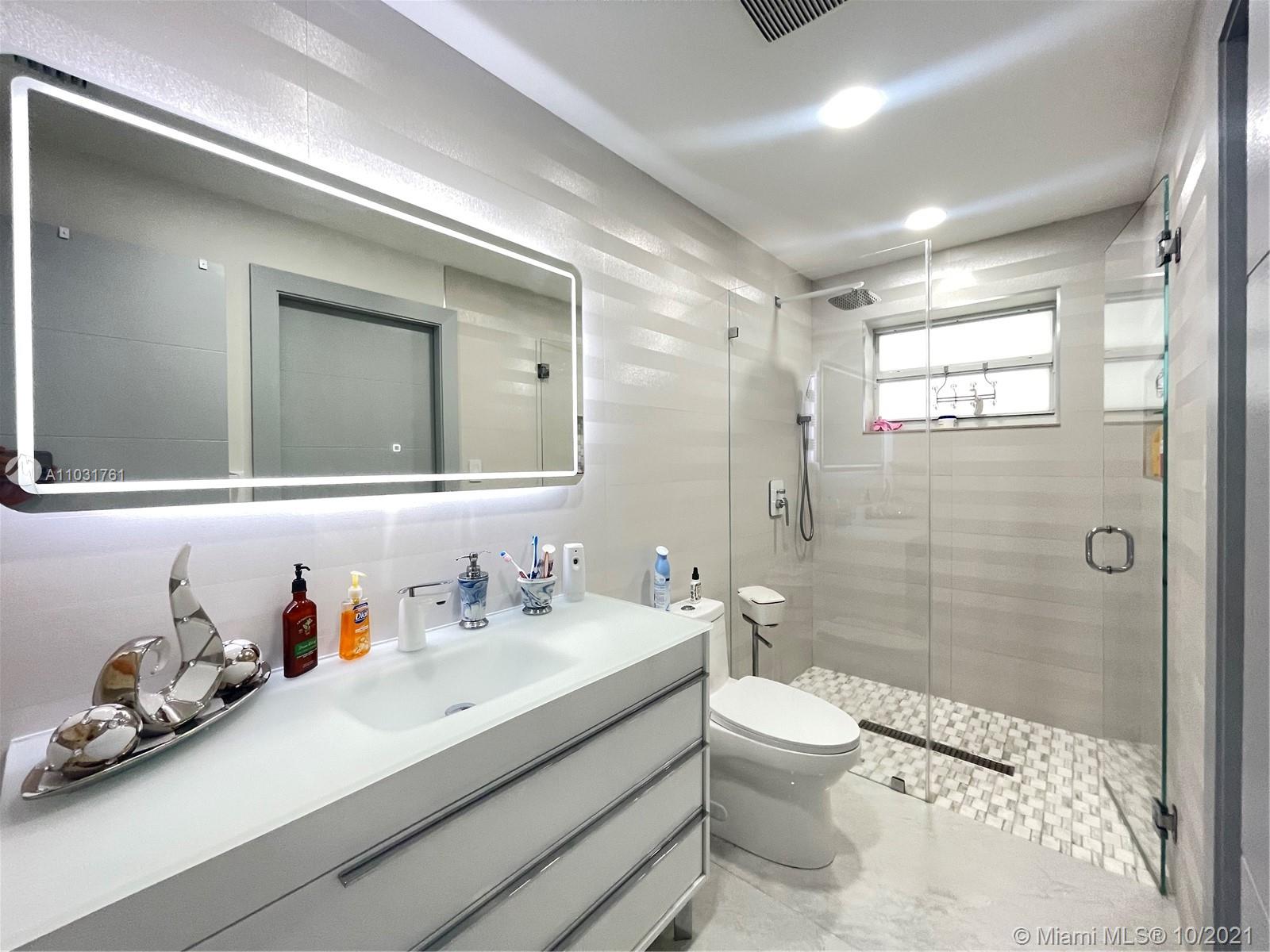 3541 Southwest 105th Court Miami, FL 33165 - Photo 15 of 45 a bathroom with a sink a toilet and shower