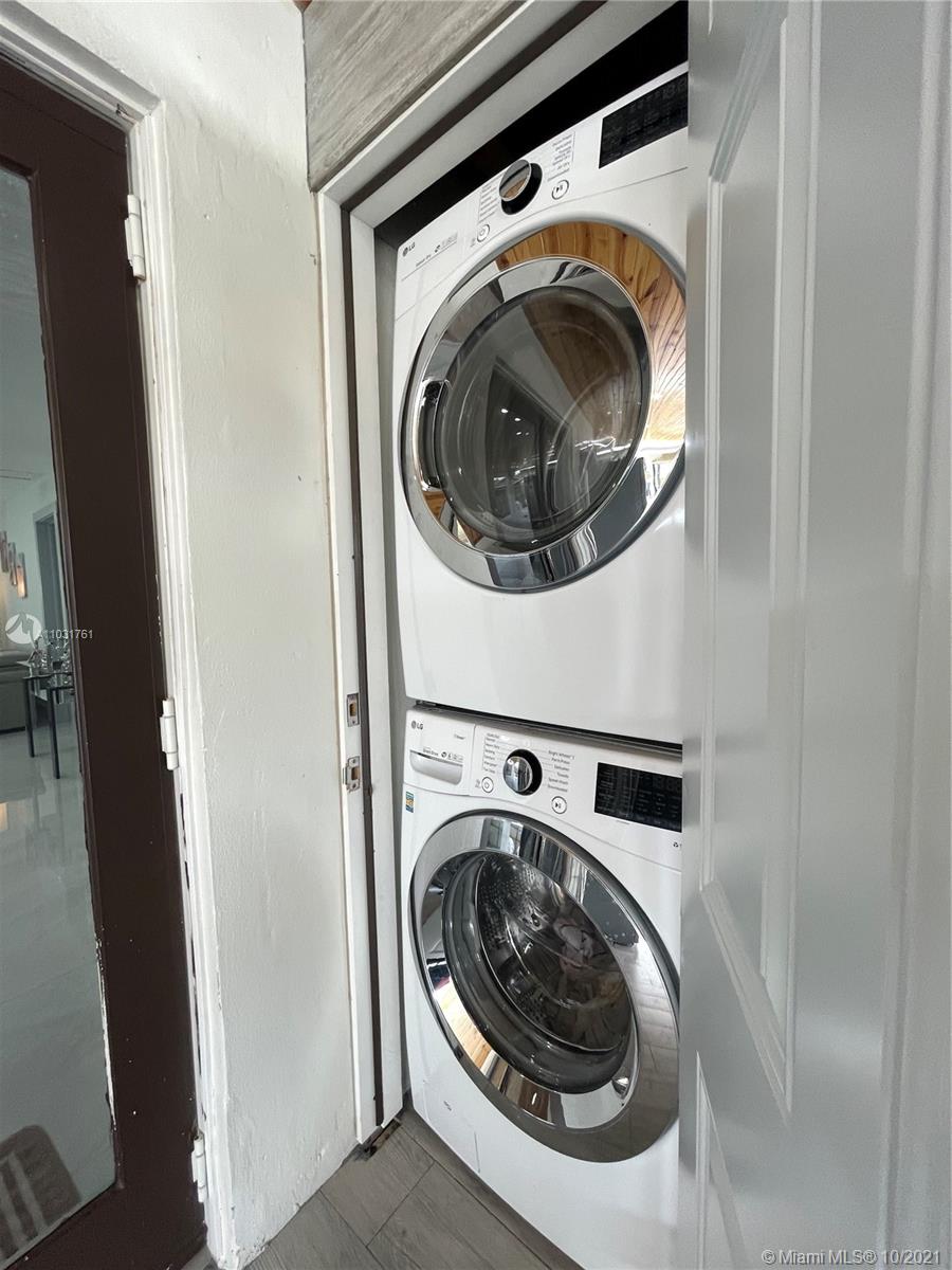 3541 Southwest 105th Court Miami, FL 33165 - Photo 17 of 45 a utility room with dryer and washer