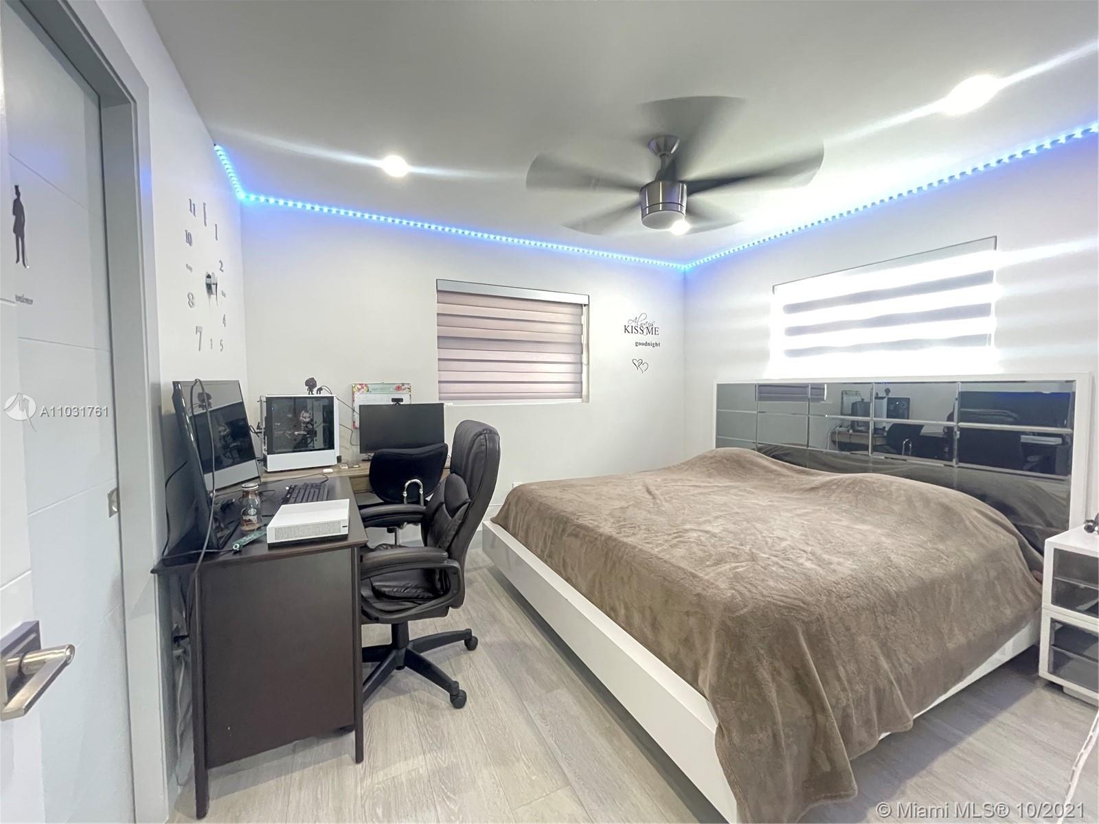 3541 Southwest 105th Court Miami, FL 33165 - Photo 18 of 45 a bedroom with a bed and a desk