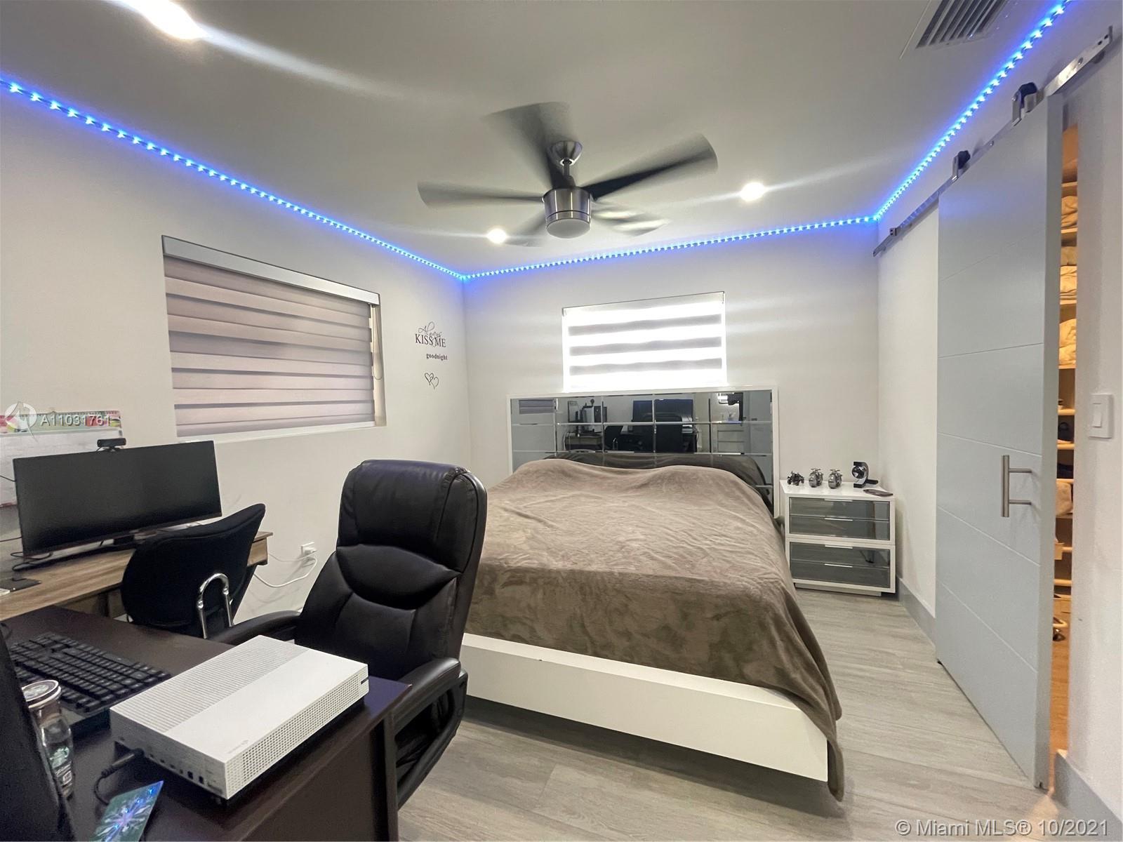 3541 Southwest 105th Court Miami, FL 33165 - Photo 19 of 45 a bedroom with a bed and wooden floor
