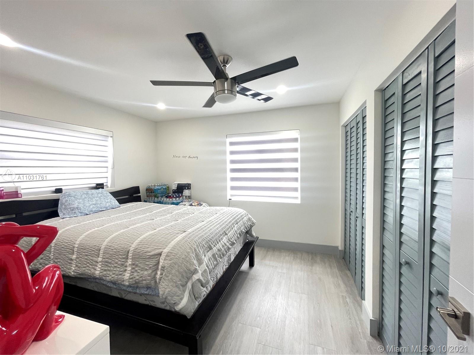 3541 Southwest 105th Court Miami, FL 33165 - Photo 20 of 45 a bedroom with a large bed and a window