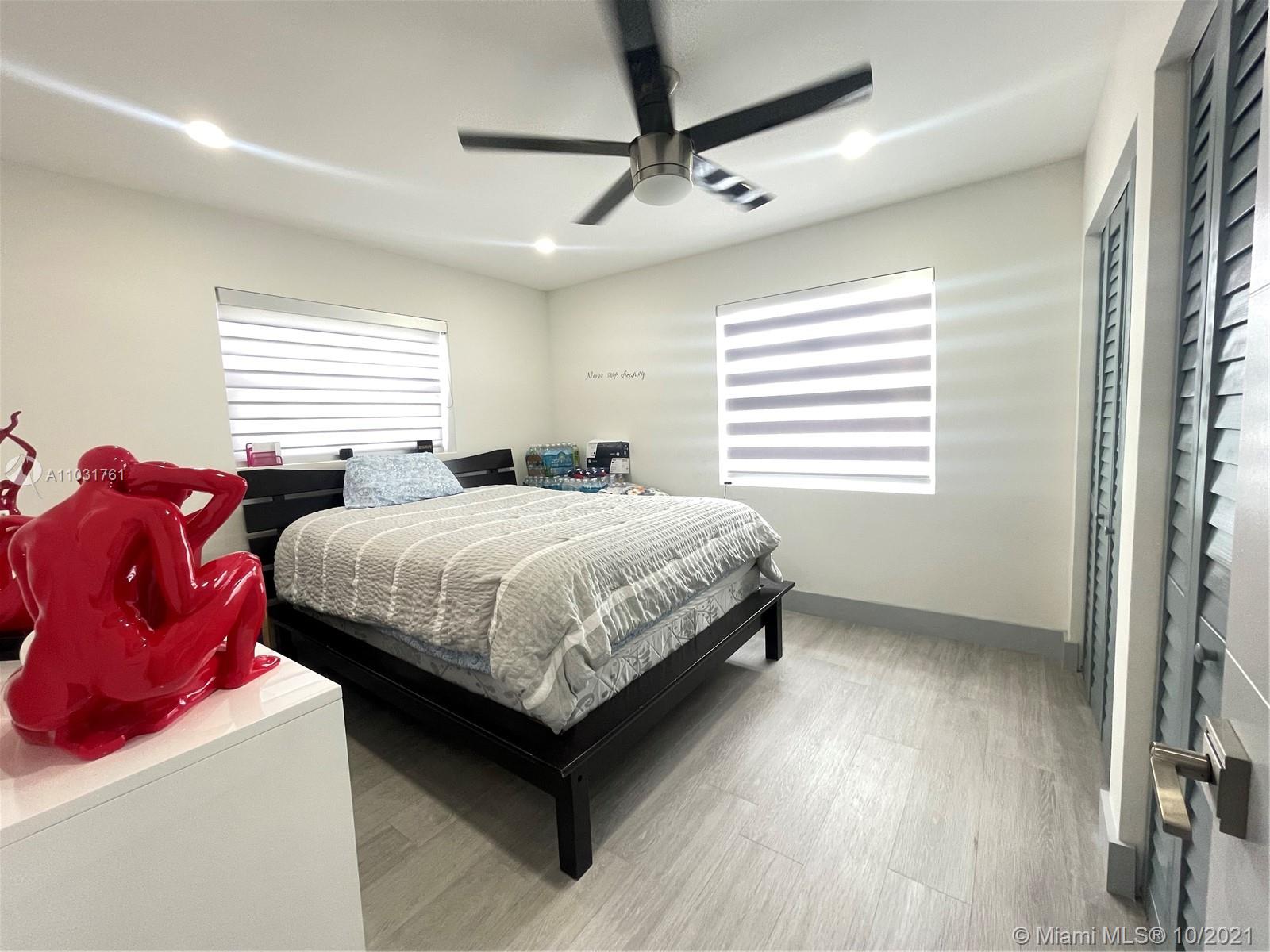 3541 Southwest 105th Court Miami, FL 33165 - Photo 21 of 45 a bedroom with a bed and window