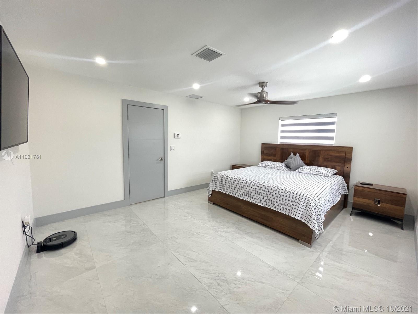 3541 Southwest 105th Court Miami, FL 33165 - Photo 22 of 45 a bedroom with a bed and a ceiling fan