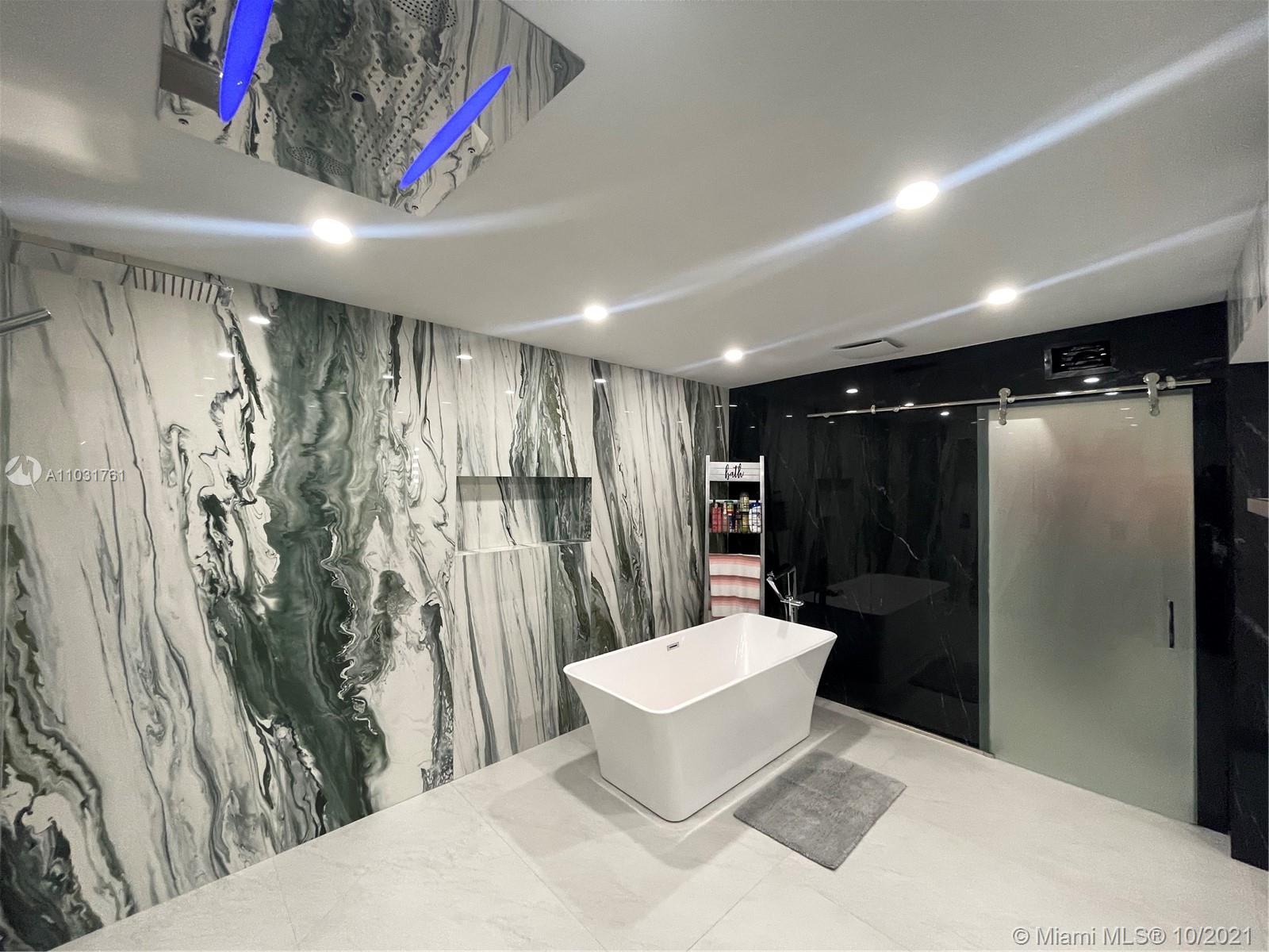 3541 Southwest 105th Court Miami, FL 33165 - Photo 26 of 45 a spacious bathroom with a bathtub and shower