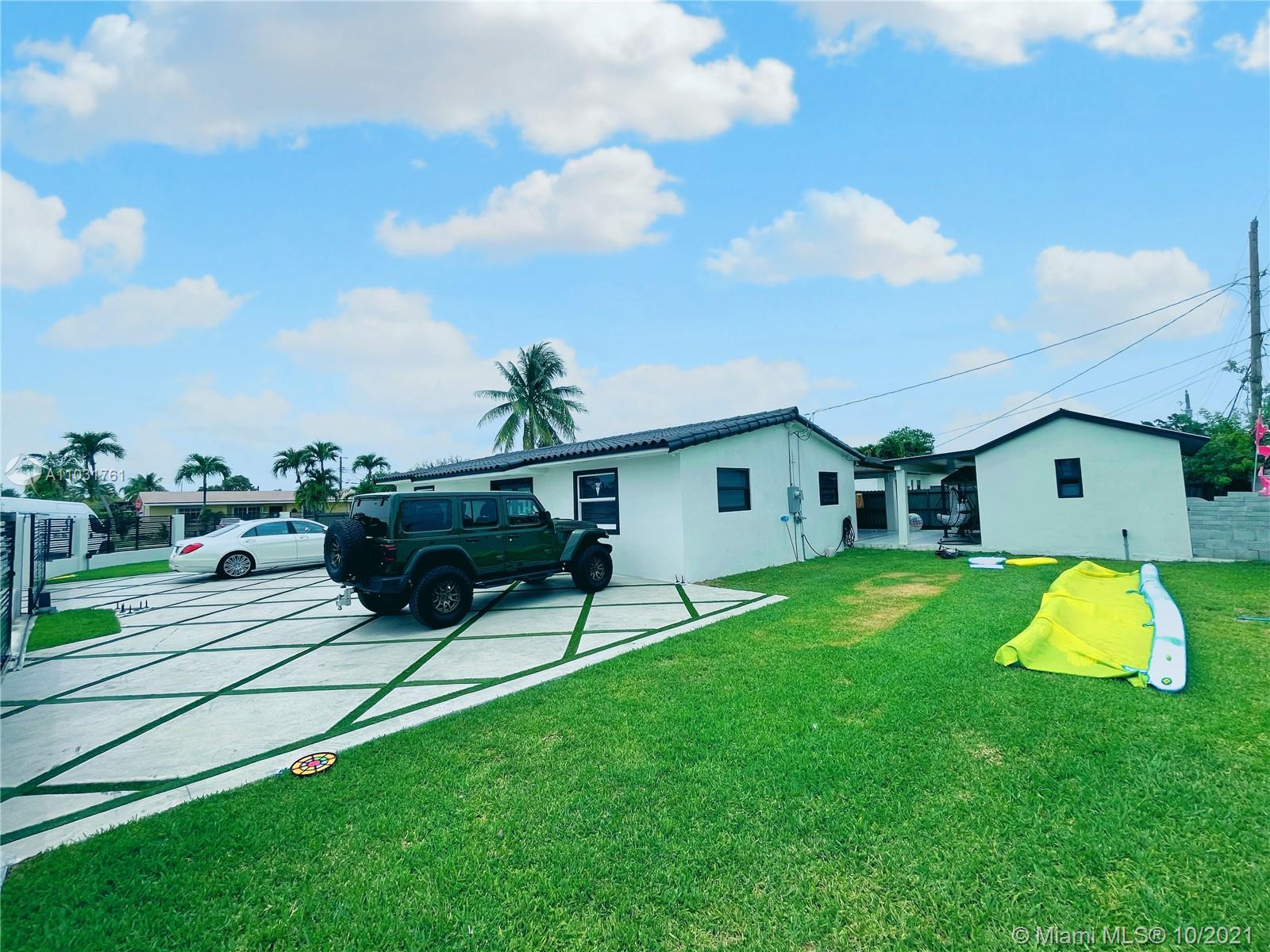 3541 Southwest 105th Court Miami, FL 33165 - Photo 41 of 45 a backyard of a house with table and chairs