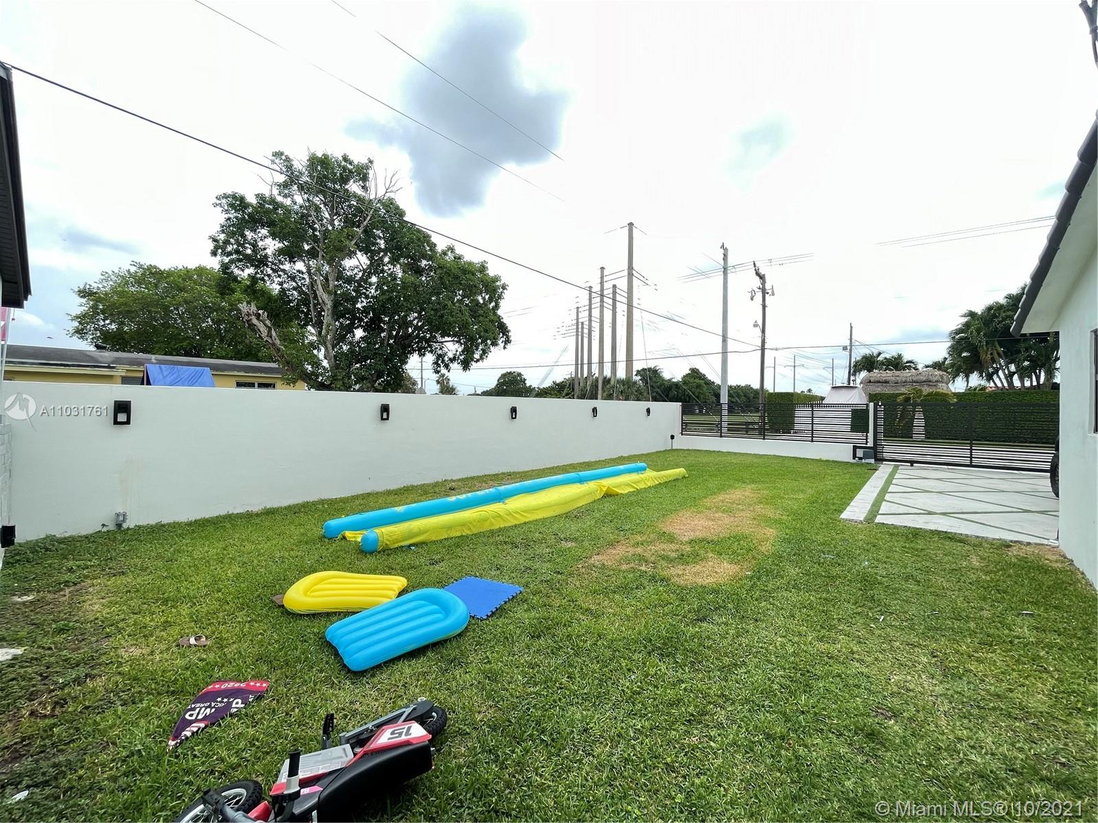 3541 Southwest 105th Court Miami, FL 33165 - Photo 42 of 45 a view of a lake with a big yard