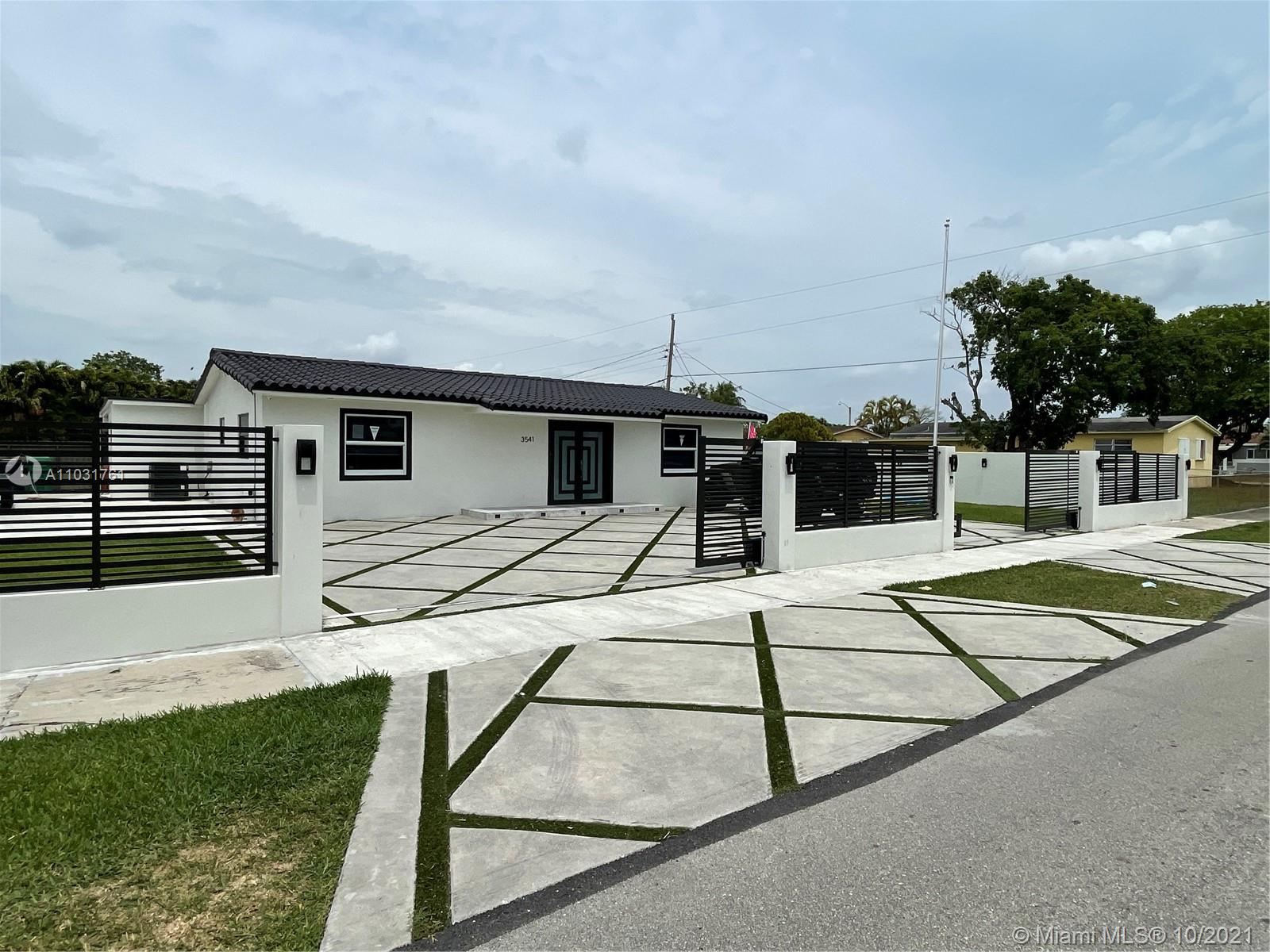 3541 Southwest 105th Court Miami, FL 33165 - Photo 44 of 45 a house view with a backyard space
