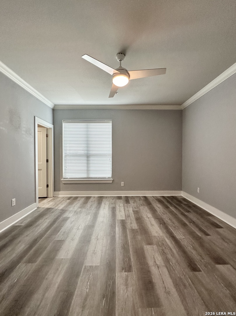 831 Terrell Road, Unit 103 San Antonio, TX 78209 - Photo 4 of 8 wooden floor in an empty room with a window