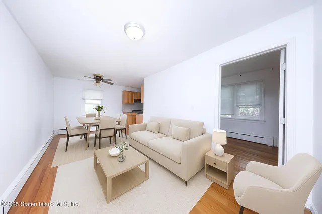 a living room with furniture and a table