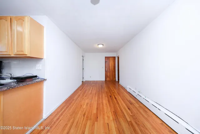 a view of a livingroom with wooden floor