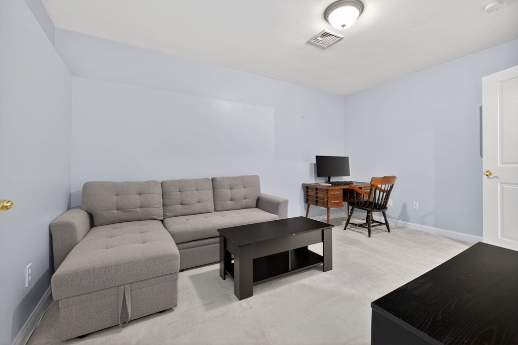 36 Prospect Street, Unit 1 Waltham, MA 02453 - Photo 14 of 16 a living room with furniture