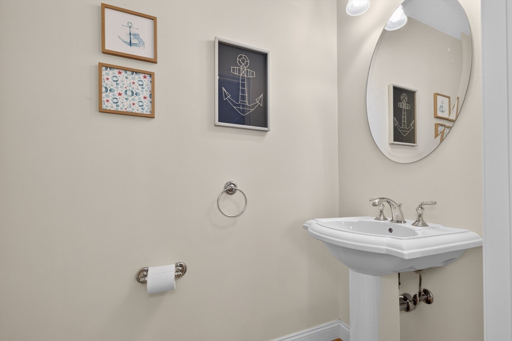 36 Prospect Street, Unit 1 Waltham, MA 02453 - Photo 8 of 16 a bathroom with a sink and mirror