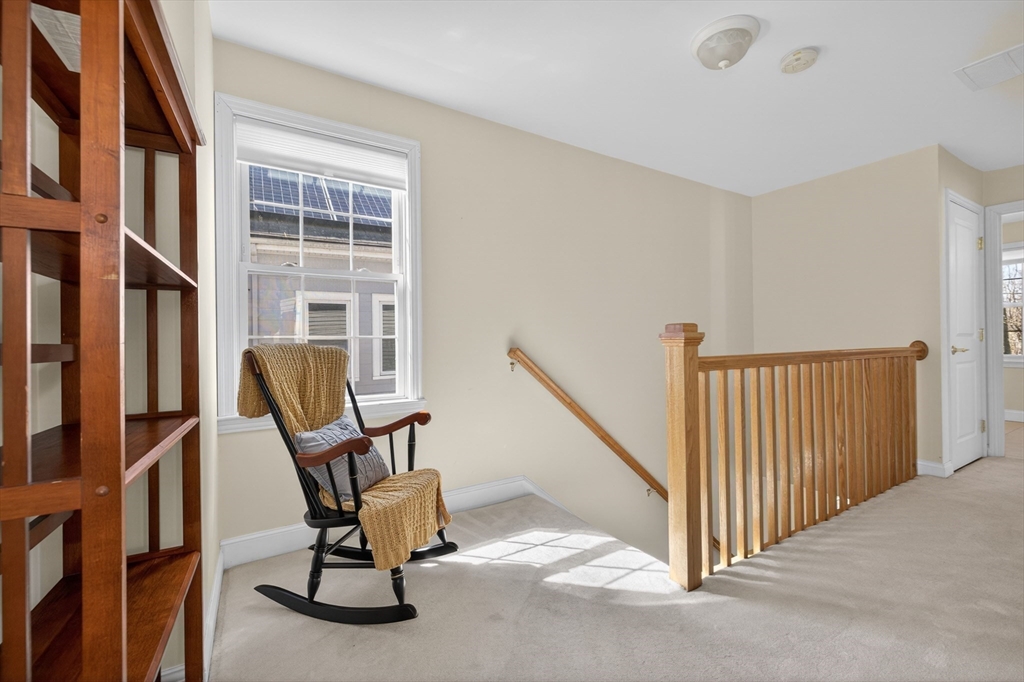 36 Prospect Street, Unit 1 Waltham, MA 02453 - Photo 9 of 16 a view of a livingroom with furniture and a window