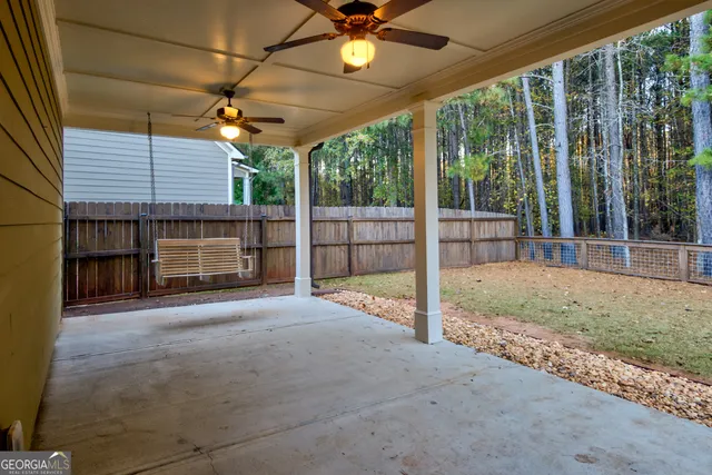 a kitchen with stainless steel appliances granite countertop a refrigerator a stove a sink and a microwave