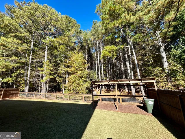 a view of a kitchen and dining room with wooden floor