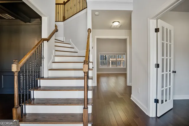 a bathroom with a tub a sink and a mirror