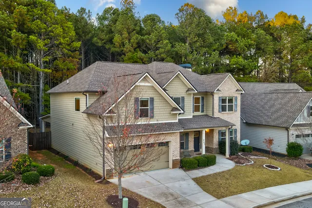 a bathroom with a granite countertop shower a mirror and a sink