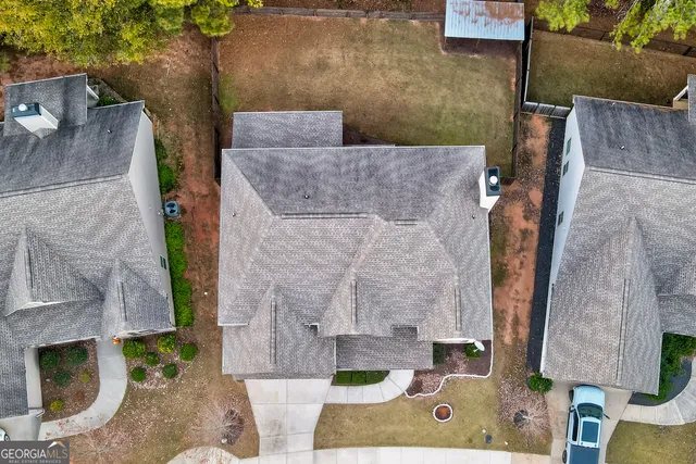 a front view of a house with a large window